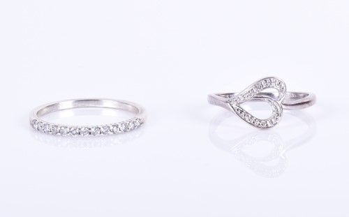 Lot 189 - A silver and diamond half eternity ring size N...