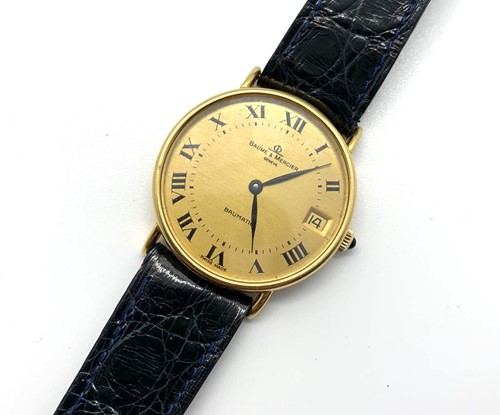 Lot 462 - An 18ct yellow gold Baume and Mercier wrist...