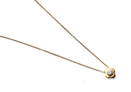 Lot 266 - An 18ct yellow gold diamond pendant on a trace...
