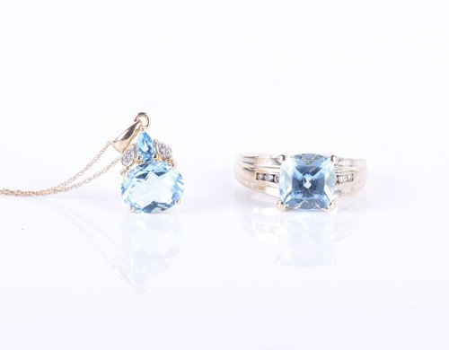 Lot 274 - A 9ct yellow gold, diamond, and blue topaz...