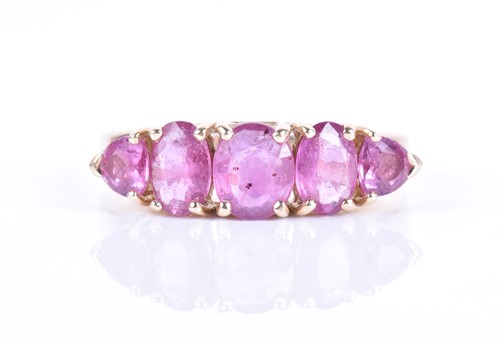 Lot 284 - A 14ct yellow gold and pink sapphire ring set...
