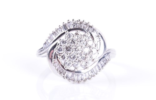 Lot 292 - A white metal and diamond swirl cluster ring...