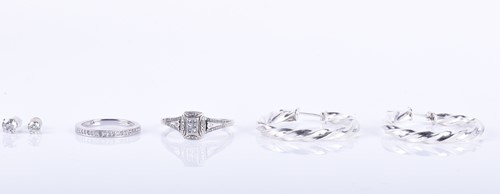 Lot 295 - A diamond set half eternity band 2mm wide,...