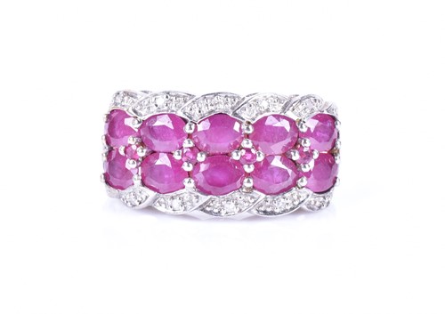 Lot 330 - A 9ct white gold, diamond, and ruby ring set...