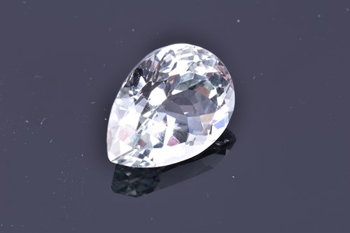 Lot 795 - A loose mixed pear-cut pale blue topaz of...