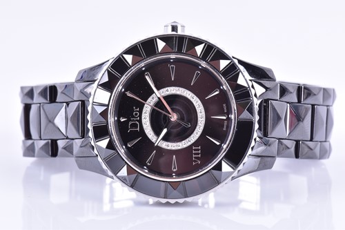 Lot 534 - A Dior VIII black polished stainless steel...