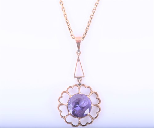 Lot 181 - A yellow metal and synthetic corundum pendant,...