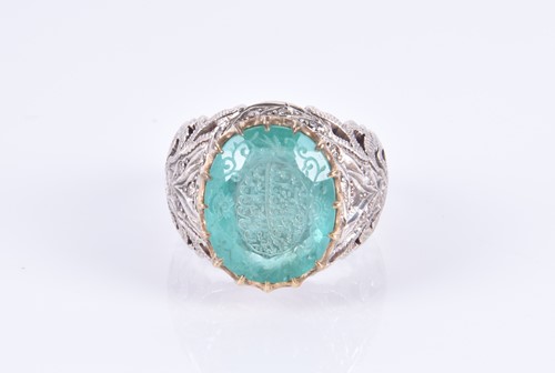 Lot 342 - An unusual silver and emerald Islamic ring,...