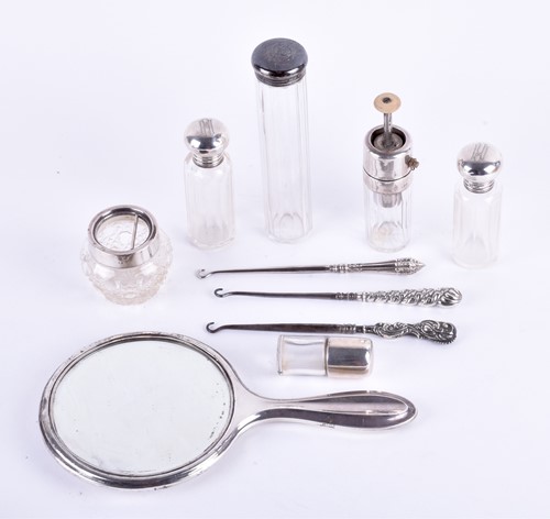 Lot 591 - A collection of silver topped dressing table...