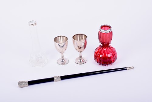 Lot 610 - A conductors ebonised baton with silver plated...
