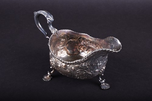 Lot 612 - An early Geo III silver gravy boat, Daniel...