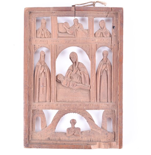 Lot 469 - A 19th century Russian carved wood icon with...