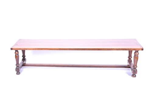 Lot 136 - A refectory style coffee table, 20th century,...