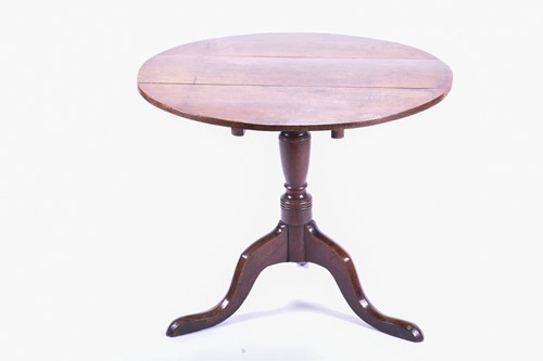 Lot 152 - A Geo III oak tilt top tripod table, with...