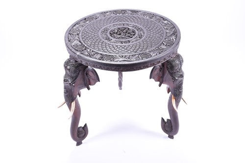 Lot 166 - An Indian carved ebony occasional table, the...