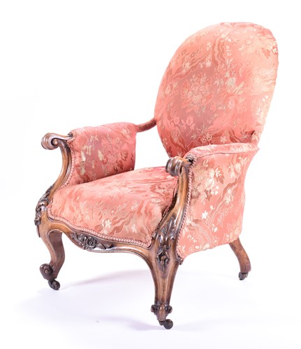Lot 100 - A Victorian upholstered armchair with carved...