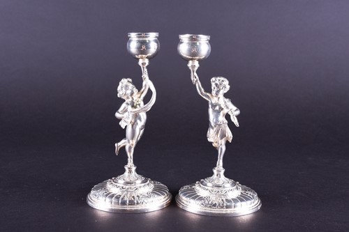 Lot 639 - A pair of Elkington silver-plated candlesticks,...
