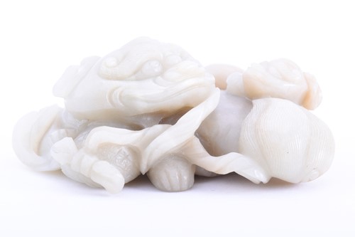 Lot 213 - A Chinese carved jade shi-shi and cub, early...