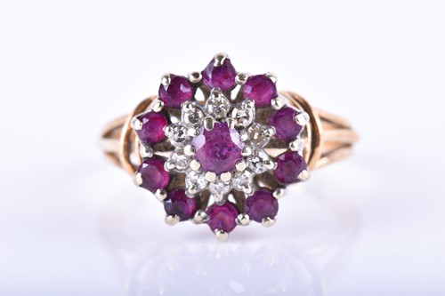 Lot 871 - A 9ct yellow gold, diamond, and ruby cluster...