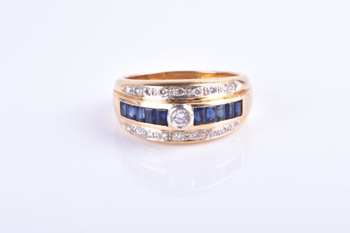 Lot 709 - An 18ct yellow gold, diamond, and sapphire...