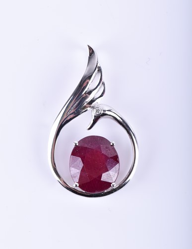 Lot 892 - A 14k white gold, diamond, and ruby pendant...