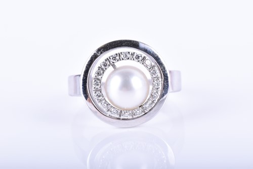 Lot 771 - A diamond and pearl ring set with a pearl to...