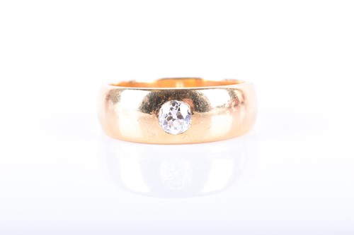 Lot 900 - An 18ct yellow gold and diamond ring the gypsy-...