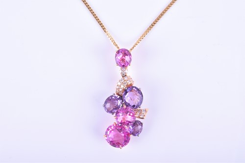 Lot 699 - An 18ct rose gold, diamond, purple and pink...