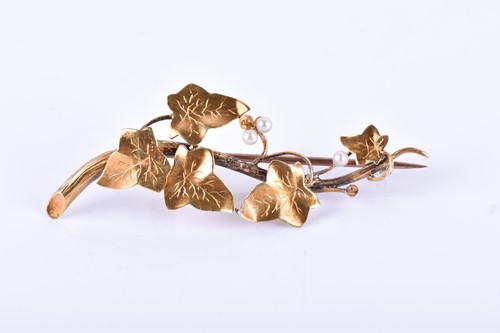 Lot 852 - A 15ct yellow gold and pearl foliate spray...
