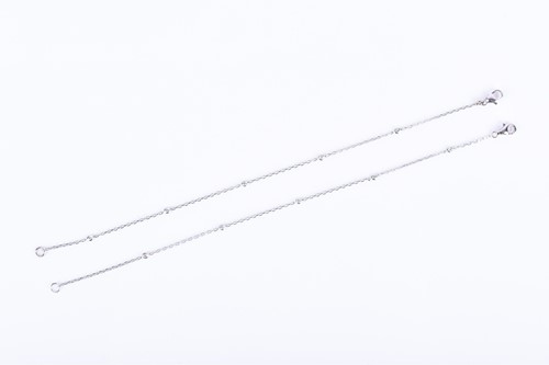 Lot 832 - A pair of white gold and diamond bracelets the...