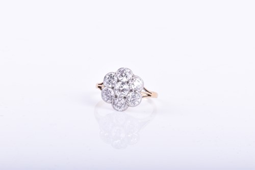 Lot 756 - A yellow metal and diamond cluster ring set...