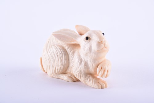 Lot 202 - A good Japanese carved ivory okimono of a hare,...