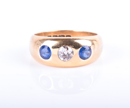 Lot 901 - An 18ct yellow gold, diamond, and sapphire...