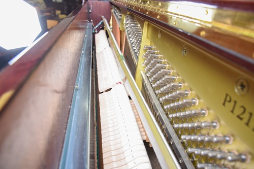 Lot 173 - A Yamaha upright piano with high gloss finish,...