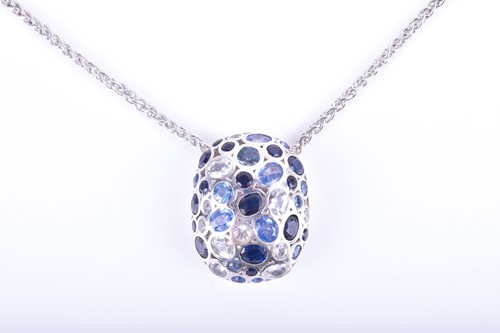 Lot 876 - A silver and sapphire pendant the honeycomb...
