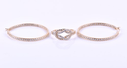 Lot 644 - A pair of yellow metal and cubic zirconia hoop...
