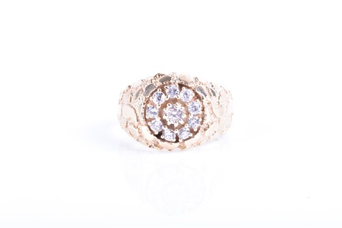 Lot 858 - A yellow metal and CZ ring set with a circular...