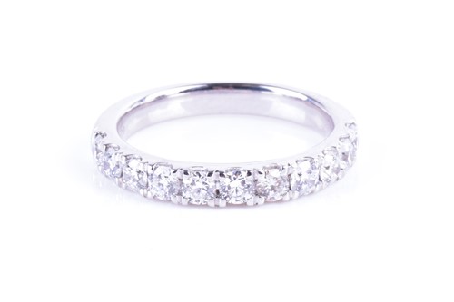 Lot 840 - A 14k white gold and diamond ring set with...