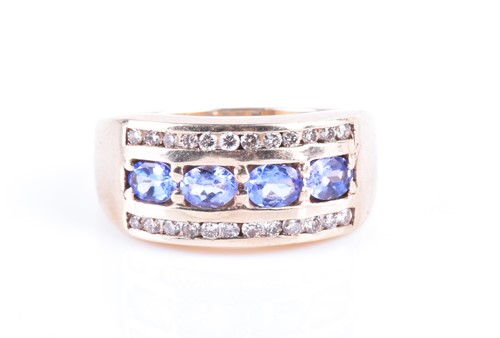 Lot 737 - A yellow metal, diamond, and tanzanite ring...