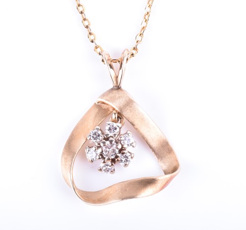 Lot 848 - A yellow metal and diamond pendant the...