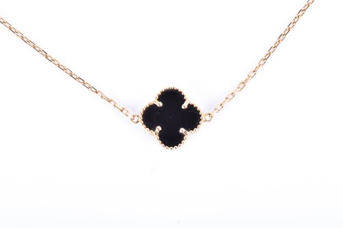 Lot 740 - A yellow metal and black onyx bracelet in the...
