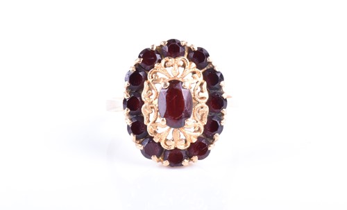 Lot 751 - A yellow metal and garnet ring set with a...
