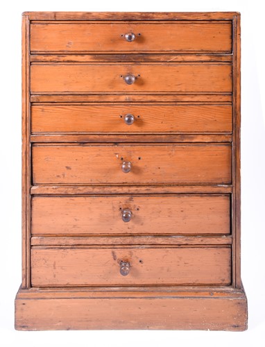Lot 110 - A late 19th century pine six drawer collectors...