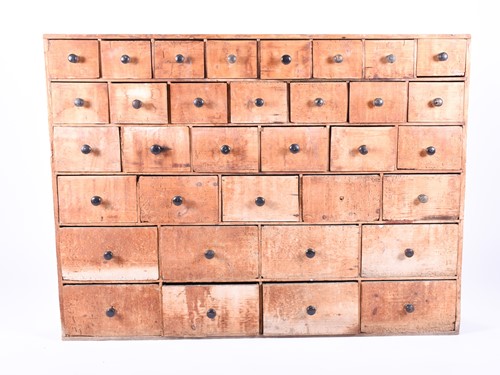 Lot 178 - A 19th century pine apothecary cabinet, with...