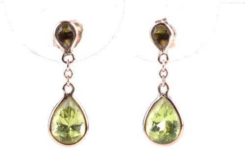 Lot 865 - A pair of 9ct yellow gold and peridot drop...