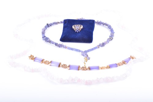 Lot 702 - A 9ct yellow gold and tanzanite ring in a...