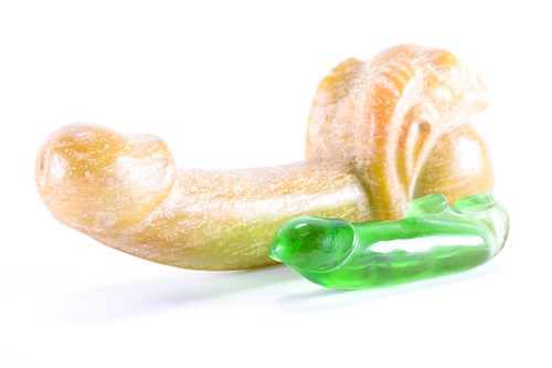Lot 348 - A carved marble male phallus with rams head...