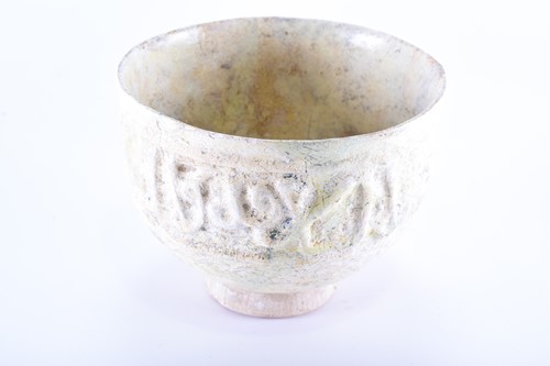 Lot 191 - A medieval Islamic pottery bowl with moulded...
