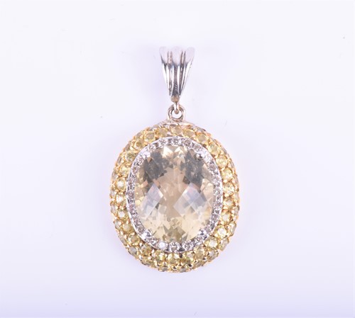 Lot 838 - An 18ct white gold, yellow sapphire and...