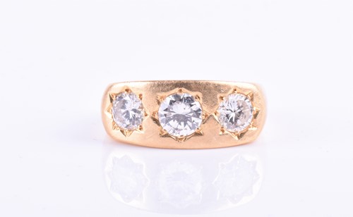 Lot 870 - An 18ct yellow gold and diamond gypsy ring set...